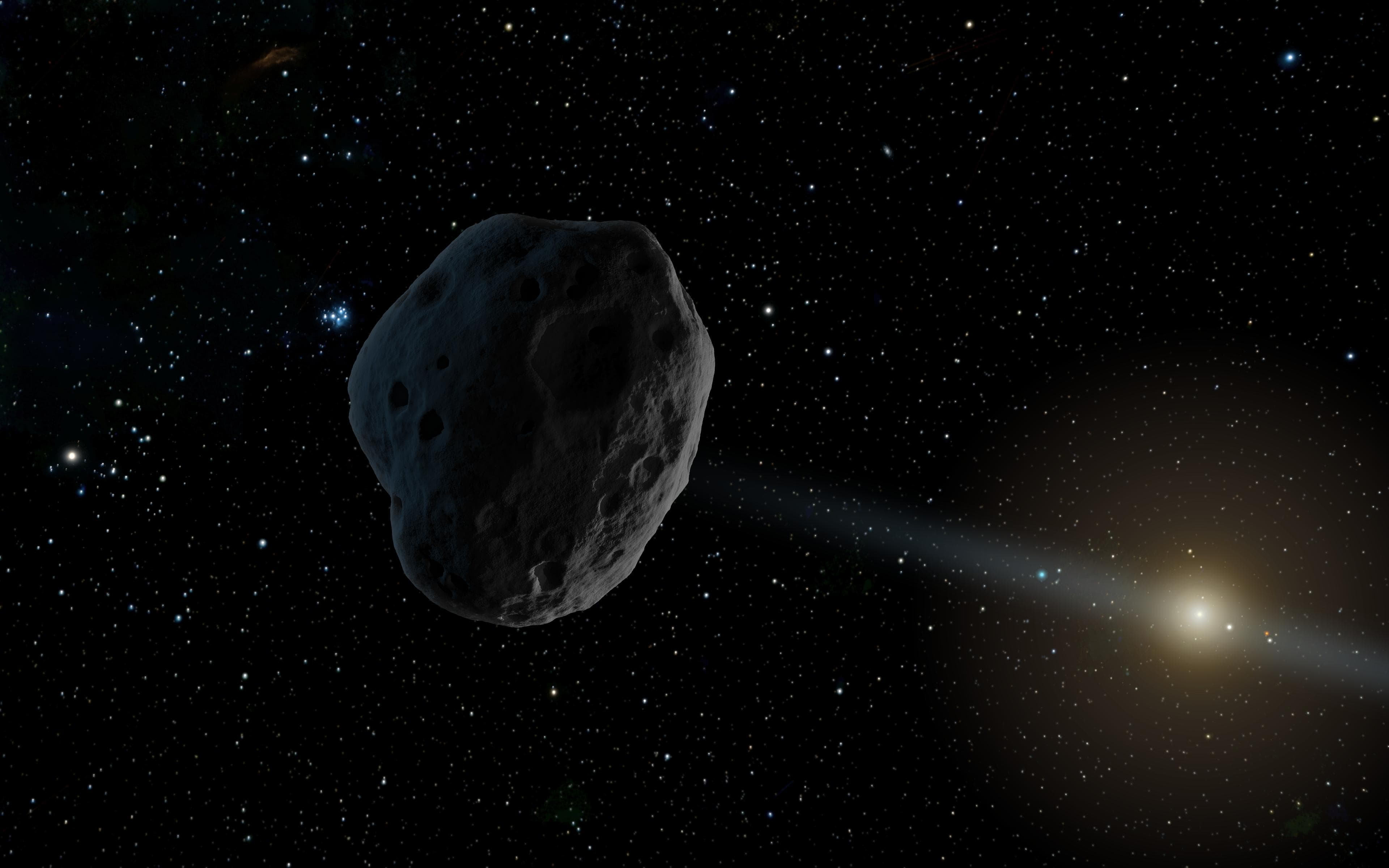 艺术家概念图:一颗近地小行星延伸出微弱的彗尾